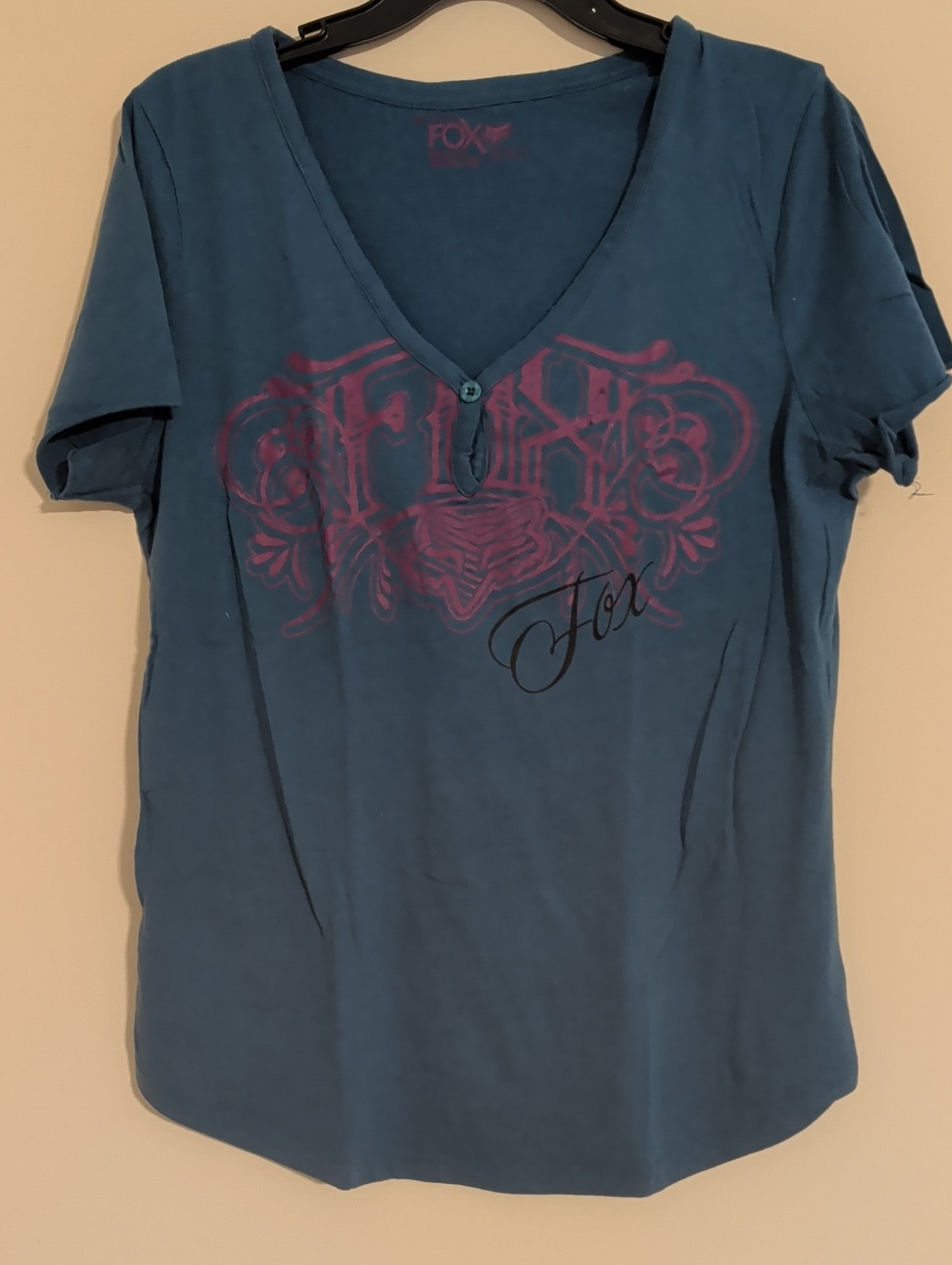Fox Teal V-Neck Short Sleeve Graphic Tee with Purple Logo